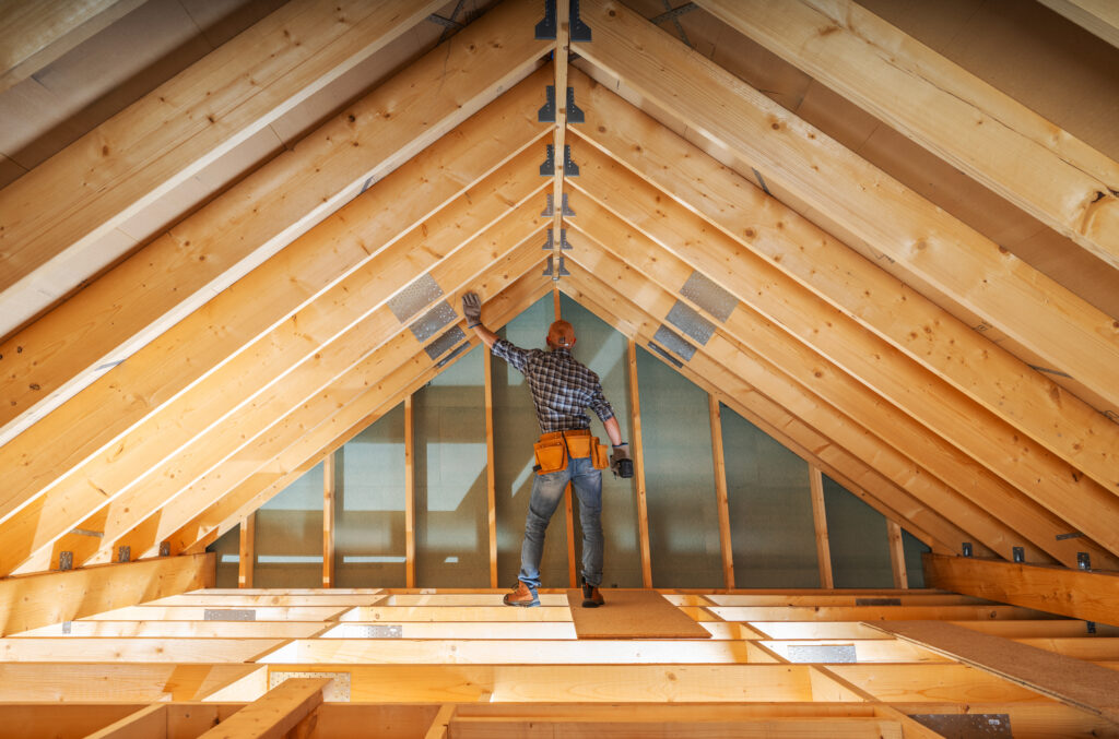 Carpenter Building Roof Trusses Inside New Home 2026 01 09 01 04 21 Utc 1024x677